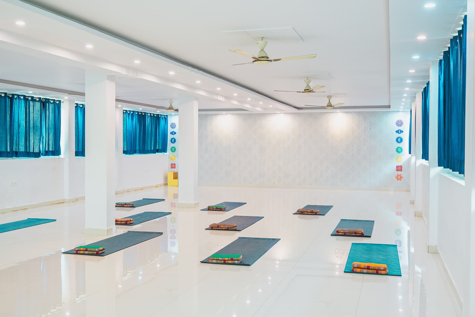 Spacious yoga hall with mats at Sriezaa Yogshala